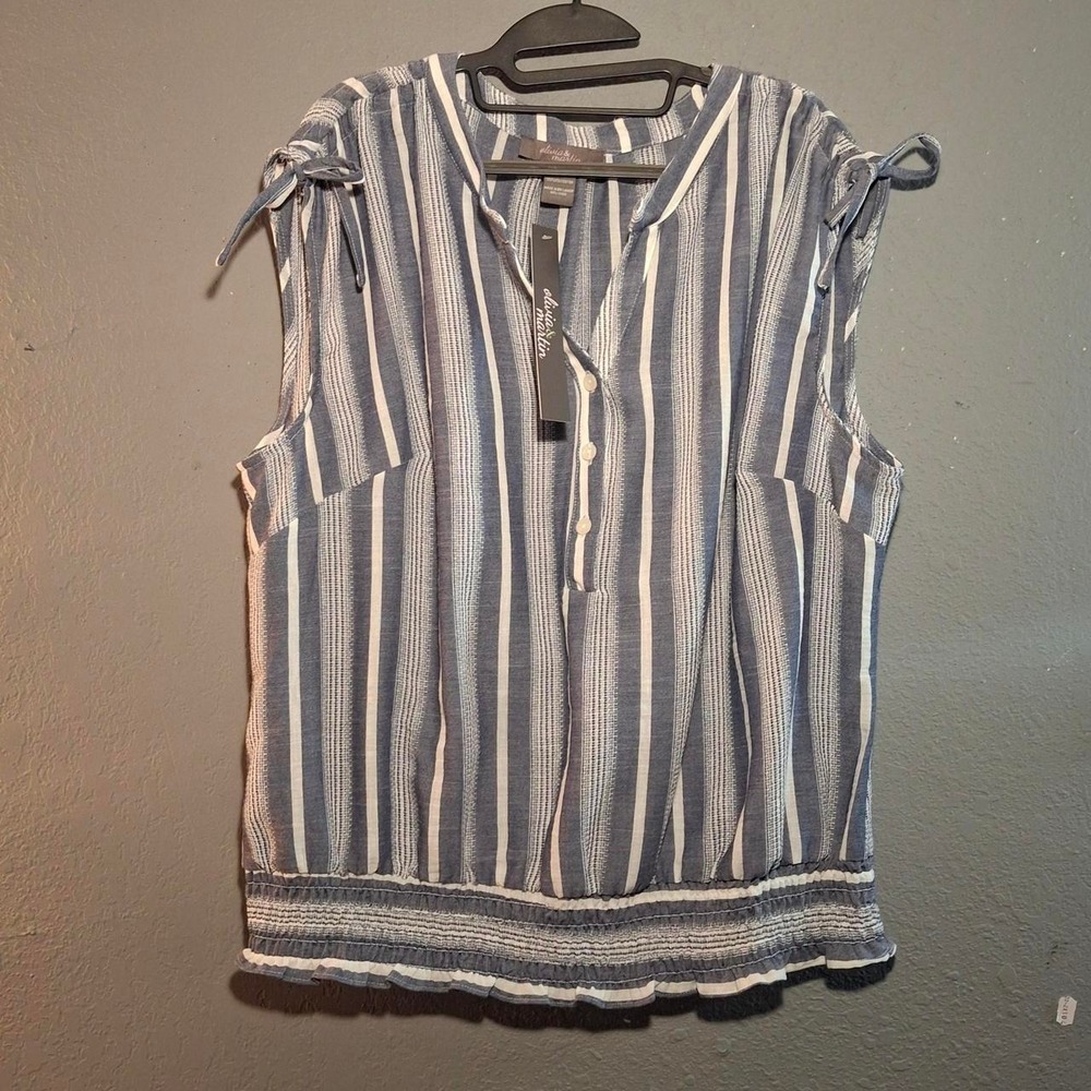 Sleeveless blue and white striped blouse